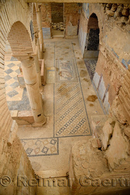 Arches and mosaic tile floor of a Slope House ruin on Curetes street of ancient Ephesus Turkey