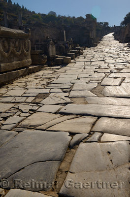 Worn stones of Curetes street in morning sun at ruins of ancient Ephesus Turkey