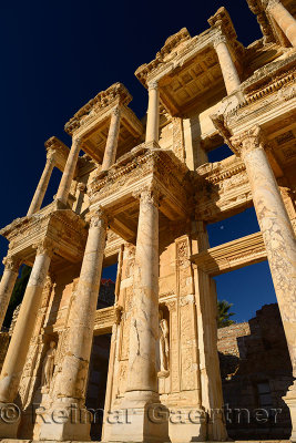 Facade of the Library and Mausoleum of Celsus with moon in blue sky at ancient city of Ephesus Turkey