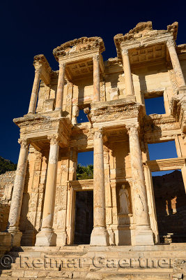 Morning sun on the facade of the Roman Library of Celsus with statue of Arete in ancient Ephesus Turkey