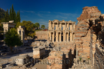 Hadrians Gate pillars and Library of Celsus from Latrine ruins at ancient Ephesus Turkey