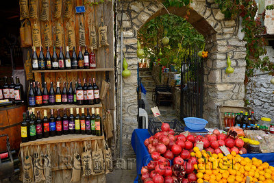 Fresh pomegranate oranges olive oil and fruit wines at a shop in rural town of Sirince Turkey
