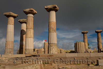 Dark clouds and Turkish flag at acropolis of Temple of Athena Assos Behramkale Turkey