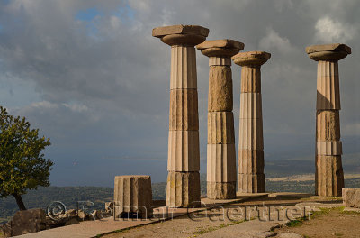 Doric column ruins of the temple of Athena with west view of Aegean Sea coast at Assos Behramkale Turkey