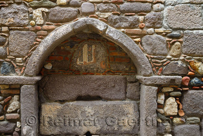 Elaborate stonework in wall at hamlet village of Assos Iskele Turkey
