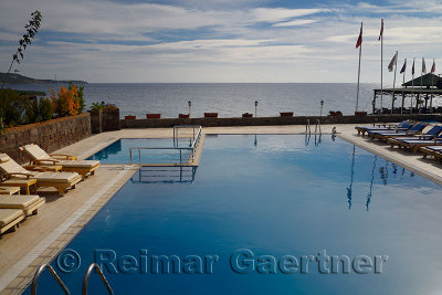 Resort hotel pool over the Aegean Sea at Assos Iskele Behram Turkey