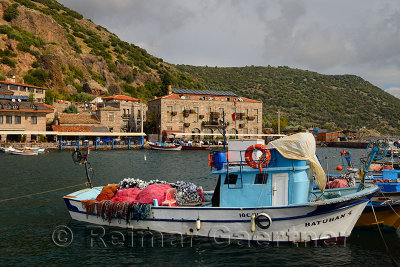 Seaside village hamlet of Assos Iskele or Behram Turkey with boats hotels and restaurants