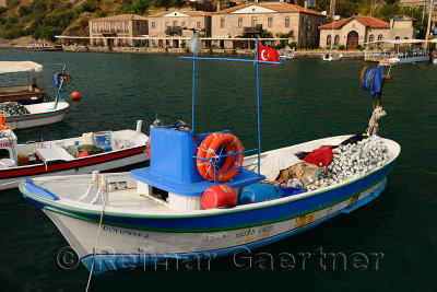Fishing boats and hotels in the picturesque hamlet of Assos Iskele or Behram Turkey