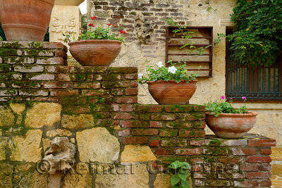 Terracotta flowerpots on an outdoor staircase wall in hillside town of Yesilyurt Malatya Turkey