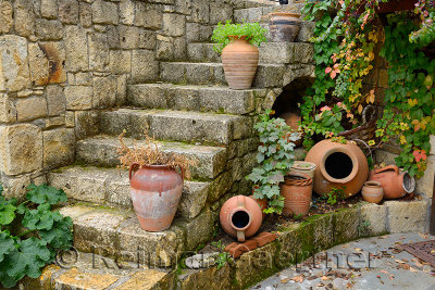 Terracotta flowerpots on an outdoor stone staircase in hillside town of Yesilyurt Malatya Turkey