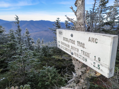 Trail sign pointing to the steepest route on the mountain