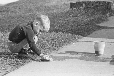 Kid: spring cleaning Simcoe sidewalk - Date: 22 BV (Before Videogames)