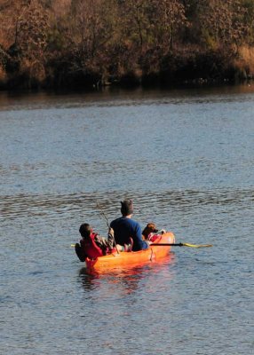 Family Kayaking the River 