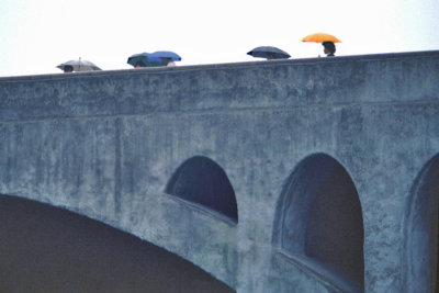 UMBRELLAS ON BRIDGE