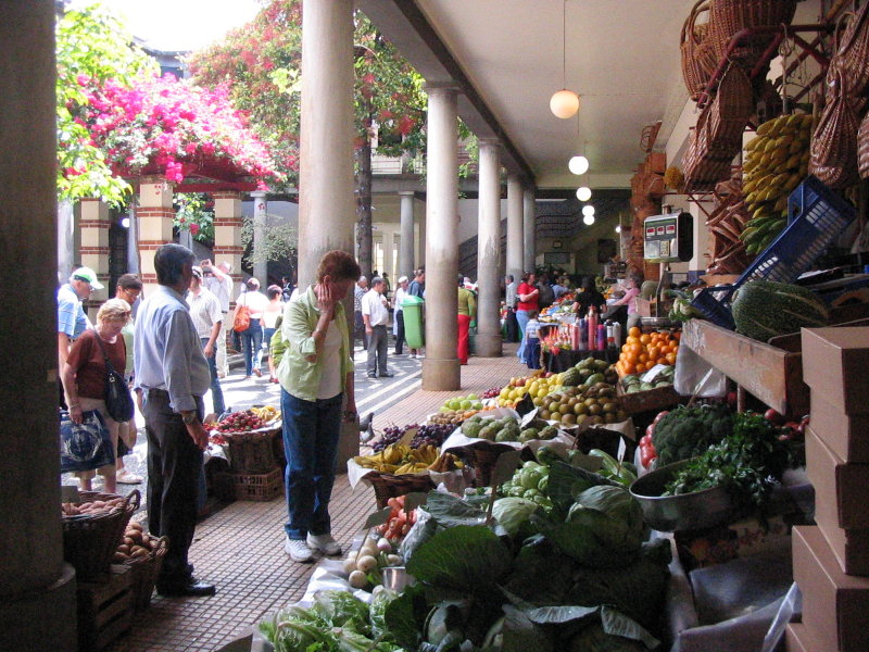 Mary ponders the fruit stand