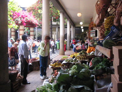 Mary ponders the fruit stand