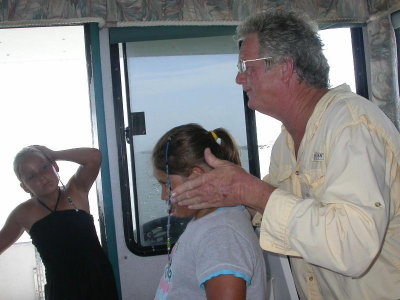 Captain George demonstrates a dolphin on Abbie