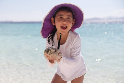 Playing with sand, Banol Beach