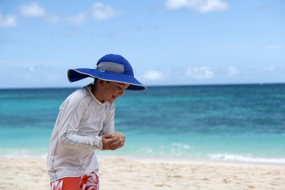 Playing with sand, Puka Shell Beach