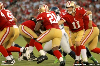 San Francisco 49ers QB Alex Smith hands off to RB Frank Gore