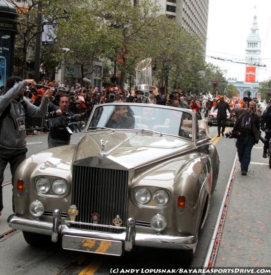 San Francisco Giants manager Bruce Bochy holding the World Series trophy