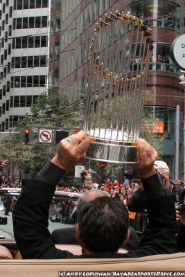 San Francisco Giants manager Bruce Bochy holding the World Series trophy