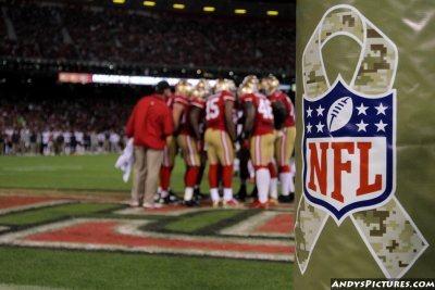 49ers huddle and NFL ribbon for Salute to Service