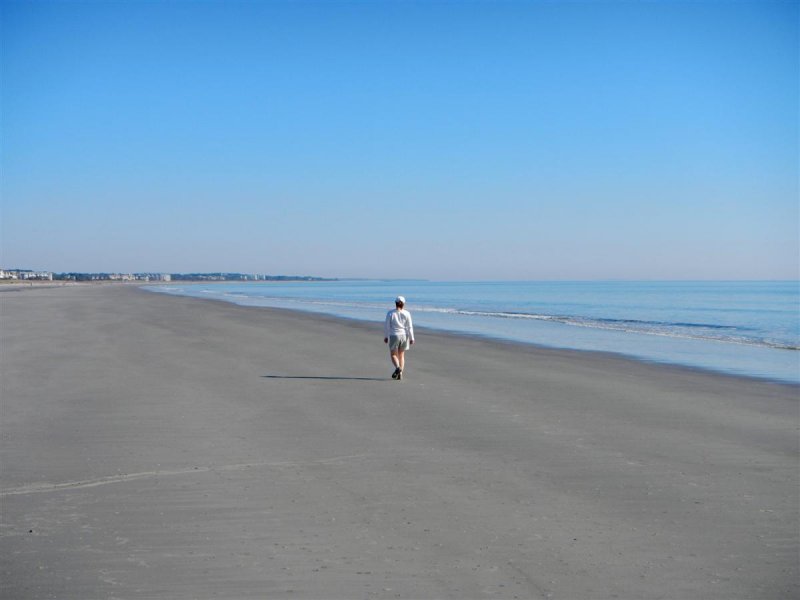 Michelle walks along beach