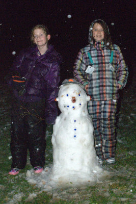 Olivia and Paige with their snowman