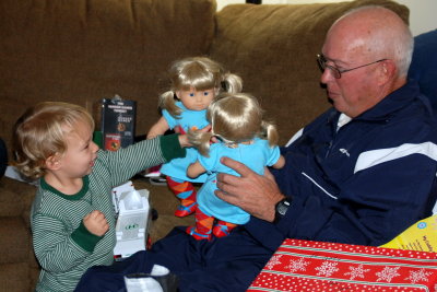 Coach and Brady playing dolls