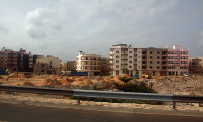 Zooming past apartments under construction