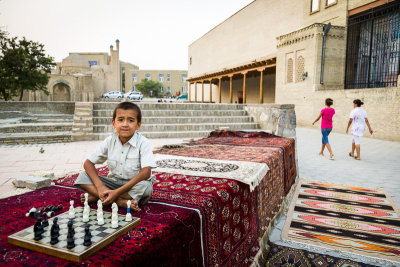 Boy with chess set - Uzbekistan