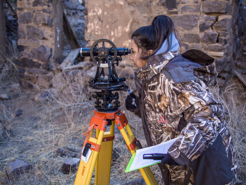 Vanessa Carrillo using a standard theodolite