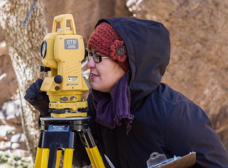 Kristin Corl using the total station