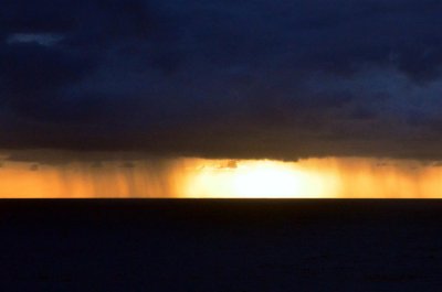 Heavy rain at sunrise over the Pacific