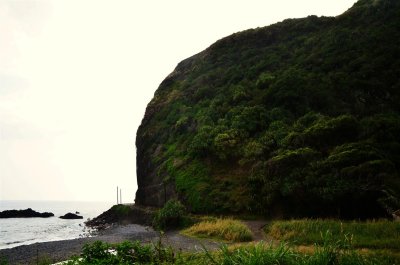 A slice of the cliff removed for the highway