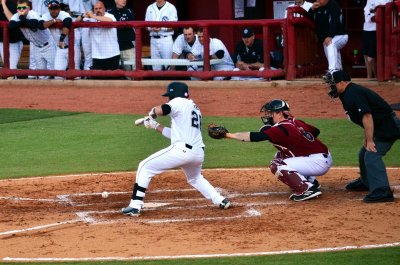 Iskenderian drops a bunt in front of the plate to move the runners