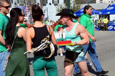 A cowboy selling shots