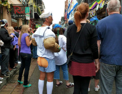 Someone Admiring the Buns at Greasing of the Poles