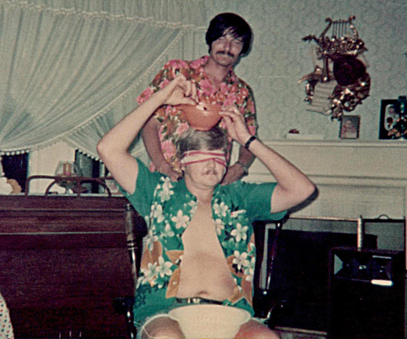 We hosted a Luau in 1975. Jack & Paul participate in the silly games.