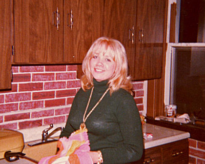 Sharon in the kitchen of our old house.