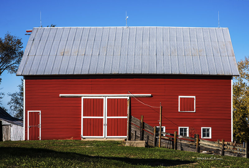 Bright red barn on an autumn day really stands out. This one should last another hundreds years. 
An image may be purchased at http://edward-peterson.artistwebsites.com/featured/nice-red-barn-edward-peterson.html