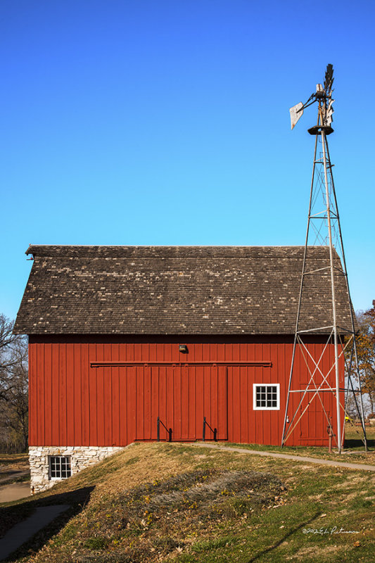 A very nicely restored barn with a nicely restored windmill next to it. This is the Coddington Barn built in 1905.
An image may be purchased at http://edward-peterson.artistwebsites.com/featured/red-barn-and-windmill-edward-peterson.html