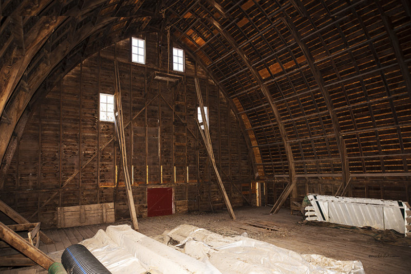This is empty but a key part of any barn is the haymow and they are always large. Here you can see the laminated rafters. Each rafter is made up of 5 boards bolted together to form the curve of the roofline.
An image may be purchased at http://edward-peterson.artistwebsites.com/featured/finken-haymow-edward-peterson.html