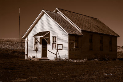 Oak School established 1870 in Mills county Iowa is still standing but the classes are no longer in session.
An image may be purchased at http://edward-peterson.artistwebsites.com/featured/oaks-school-1870-edward-peterson.html

More information is availalbe at http://indiancreekmuseum.org/