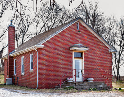 Not far south of Nebraska City, NE is a one room brick shool house known as Hazel Dell. As it has been converted to a home it should remain for a long time.
An image may be purchased at http://fineartamerica.com/featured/hazel-dell-edward-peterson.html