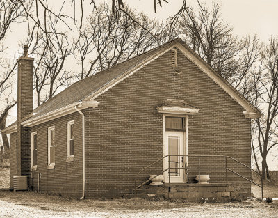 Not to far south of Nebraska City is another fine country school known as Hazell Dell. It appears to have been converted into a fine home.
An image may be purchased at http://fineartamerica.com/featured/hazell-dell-sepia-edward-peterson.html