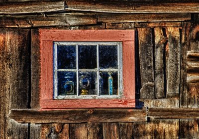 An old barn window in the late afternoon light.