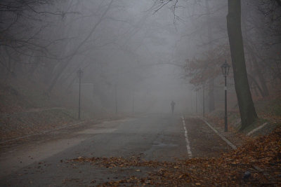 Running man disappearing in fog - Agrykola street