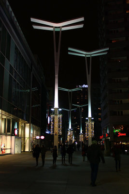 Illuminated poles on the Wiech's Passage in Warsaw